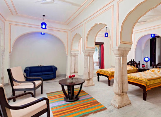 Dhula Garh jaipur bedroom with sitting chair